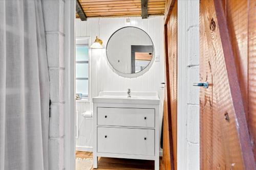 a bathroom with a sink and a mirror at LF722-Hurup-Thy-Haettemagevej-22 in Sindrup