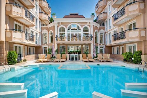 a large swimming pool in a building with a building at Dawn Park Deluxe 3 floor in Sunny Beach