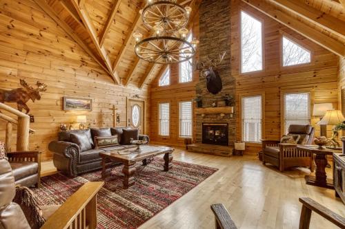 a living room filled with furniture and a fireplace at Bear Hug Cabin Gatlinburg Convenient to Everything! in Gatlinburg