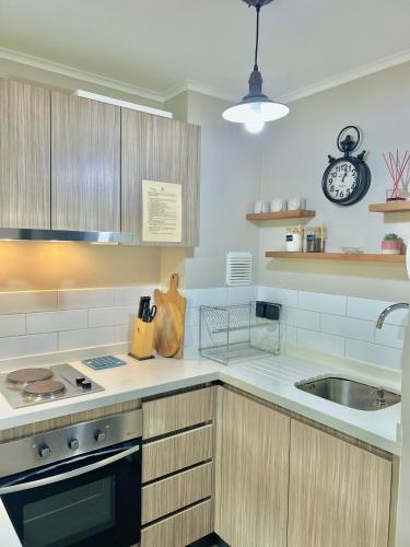 a kitchen with a sink and a counter top at Departamento Pucón in Pucón