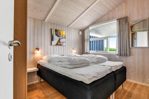 a large bed in a room with a window at BV347-Esbjerg-V-Sjelborgdalen-22 in Esbjerg