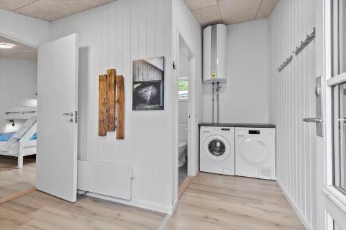a white laundry room with a washer and dryer at BV262-Billum-Ho-Bugt-Vej-6 in Billum