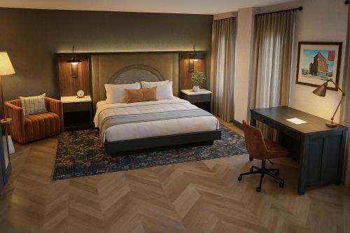 a hotel room with a bed and a desk at Hampton Inn & Suites Birmingham-Downtown-Tutwiler in Birmingham