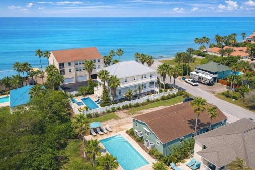an aerial view of a house and the ocean at Bay View Great Deck Pool 2 levels & 3 bedr condo in South Padre Island