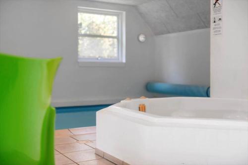 a room with a white table and a window at BV319-Blavand-Savmollen-14 in Blåvand