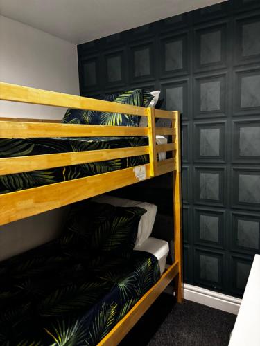 a couple of bunk beds in a room at Blackamores chalet in Mablethorpe