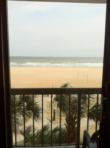 a view of the beach from a window at Wyndham Virginia Beach Oceanfront in Virginia Beach
