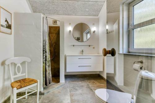 a bathroom with a sink and a mirror at BV267-Blavand-Karl-Postsvej-5 in Blåvand