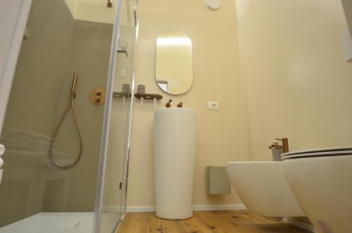 a bathroom with a glass shower and a sink at Il Cortile del Principe in Castel di Sangro