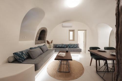 a living room with a couch and a table at Galaria Serenity Suites in Vóthon