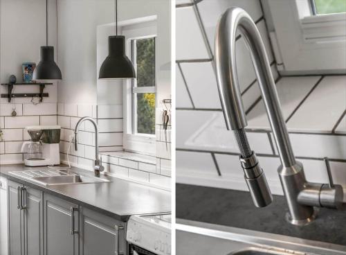 a kitchen with a sink and a faucet at BV374-Blavand-Krogsande-22 in Blåvand