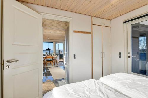 a bedroom with a bed and a view of a dining room at BV138-Esbjerg-V-Sjelborgdalen-108 in Esbjerg