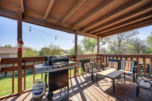 a screened in porch with a grill and a table and chairs at San Antonio Retreat with Fenced Pool, Near SeaWorld in San Antonio