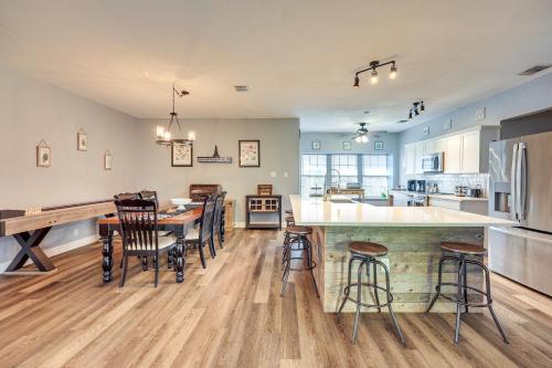 a kitchen and dining room with a table and chairs at San Antonio Retreat with Fenced Pool, Near SeaWorld in San Antonio