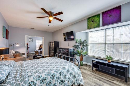 a bedroom with a bed and a ceiling fan at San Antonio Retreat with Fenced Pool, Near SeaWorld in San Antonio