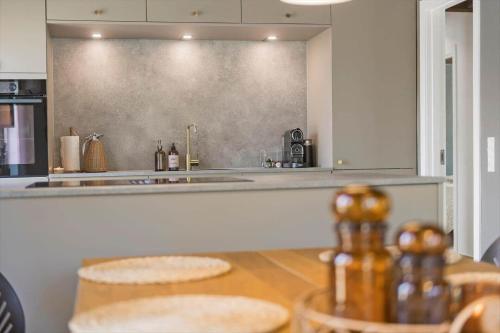 a kitchen with a sink and a counter top at BV264-Blavand-Solhaven-47 in Blåvand