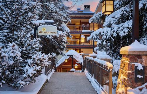a hotel in the winter with snow covered trees at Montaneros in Vail in Vail