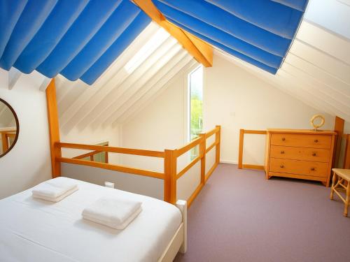 a bedroom with a bunk bed and a blue ceiling at Rural Studio with Shared Pool, Large Gardens & Tennis, Dog Friendly! Chichester Holiday Properties in Chichester