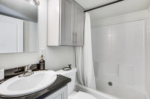 a white bathroom with a sink and a shower at Great Outdoor Space! Serene Getaway in Oakland in Oakland