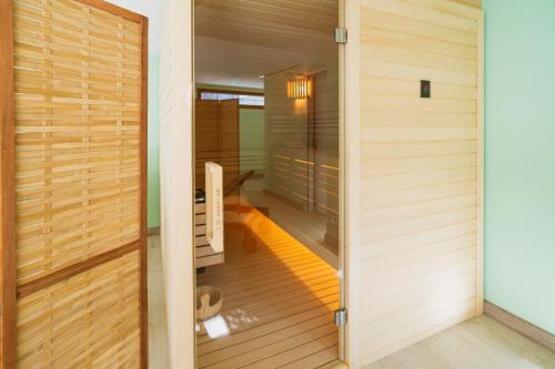 a japanese home with a sauna and wood walls at Quinta Clara in Vila Verde