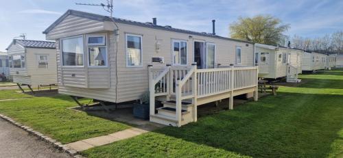 a row of mobile homes parked in a yard at Bewles Caravan in Rhyl