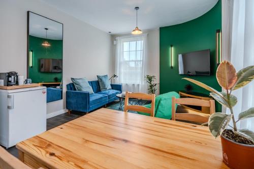 a living room with a couch and a table at The Pottergate Residence - Norwich Lanes in Norwich