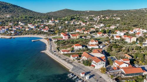 an aerial view of a small town next to the water at Villa Burica in Vinišće