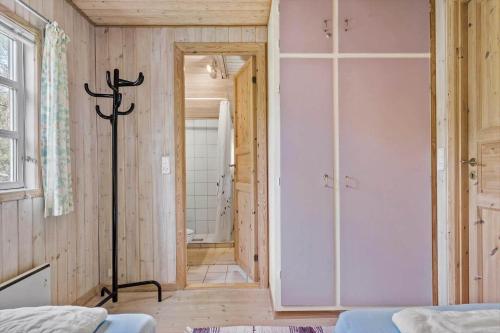 a bedroom with a walk in shower and a closet at 160-Ringkobing-Granalle-17 in Nørby