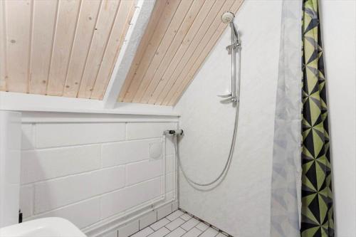 a bathroom with a shower and a toilet at 2254-Ringkobing-Nordso-Ferievej-52 in Nørre Lyngvig