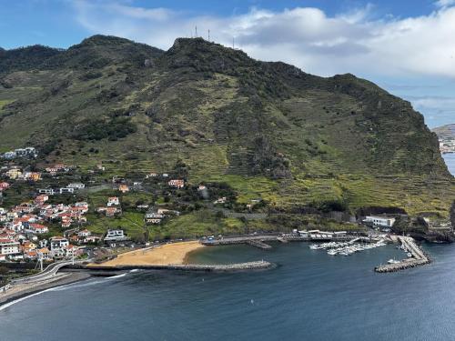 an aerial view of a small island in the water at Machico View in Machico