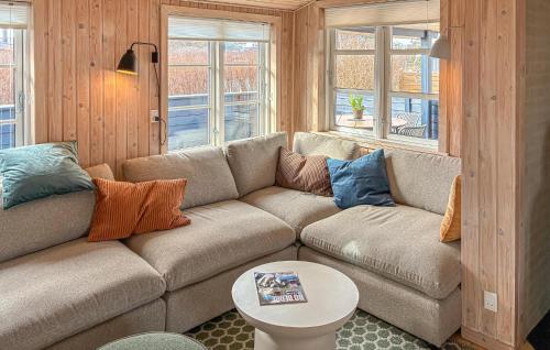 a living room with a couch and a table at 2 Bedroom Amazing Home In Slagelse in Slagelse