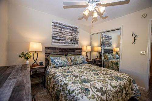 a bedroom with a bed and a ceiling fan at Lake Forest Glen # 142 in Tahoe City
