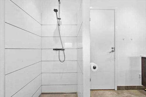 a white shower with a glass door in a bathroom at 232-Ringkobing-Jakob-Bondes-Vej-35 in Klegod
