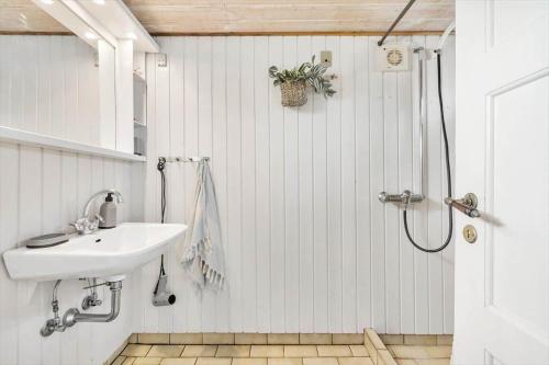 a bathroom with a sink and a shower at 1165-Ringkobing-Lodbergsvej-119 in Søndervig
