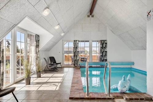 a swimming pool with a rabbit in the middle of a room at 2227-Ringkobing-Fladsbjergvej-116 in Klegod