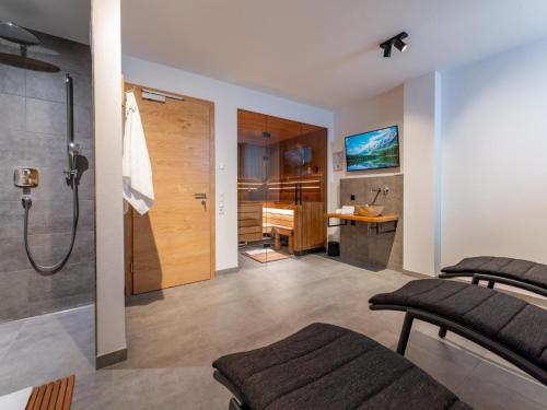a bathroom with a shower and a sink at Wagrainer TauernLodge 42B in Wagrain