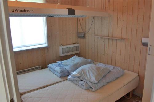 a bunk bed in a room with a window at FY292-Faaborg-Mosegarden-40 in Faaborg