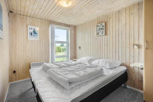 a large bed in a room with a window at FY287-Faaborg-Siovej-12 in Faaborg