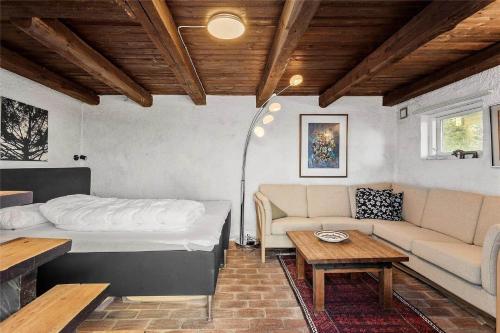 a living room with a bed and a couch at FY270-Faaborg-Lille-Stege-7 in Faaborg