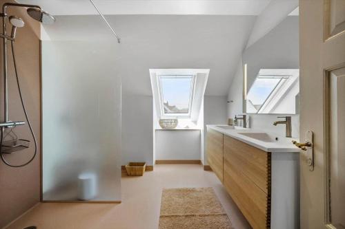 a bathroom with a sink and a window at FY399-Bogense-Ostergade-5-a in Bogense