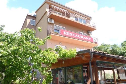 Apartments with parking space Senj - 25395