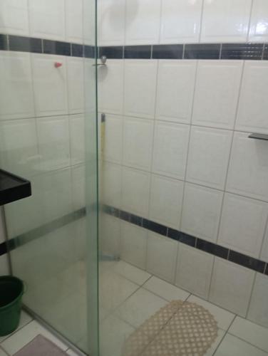 a shower with a glass door in a bathroom at FLAT PERTO do centro de convenções e Chevrolet Hall in Recife