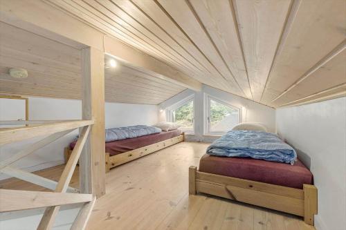 a bedroom with two bunk beds in a house at 8920-Orsted-Ternevej-16 in Ørsted
