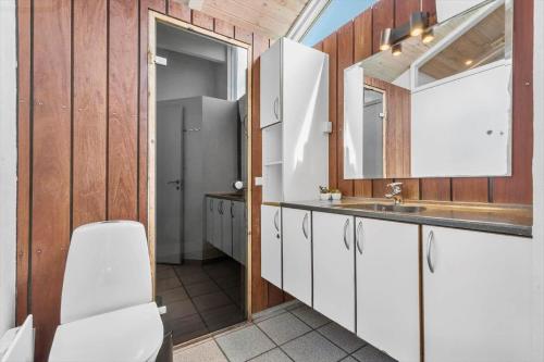 a bathroom with a toilet and a sink at 8927-Allingabro-Nordvangsvej-27 in Allingåbro