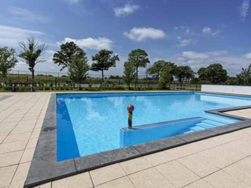 a large blue swimming pool with a ball in it at Charming Chalet in De Rijp in West-Graftdijk