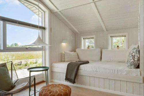 a white room with a couch and a window at 8014-Knebel-Rastestedet-16 in Knebel