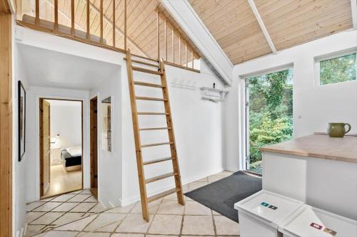 a ladder leading to the kitchen of a tiny house at 84218-Ebeltoft-Koravej-21 in Ebeltoft