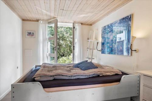 a large bed in a room with a window at 30508-Odder-Dyngby-Havvej-42 in Odder