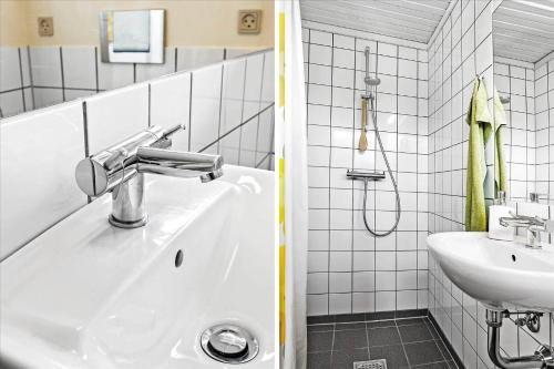 a bathroom with a sink and a bath tub at 30508-Odder-Dyngby-Havvej-42 in Odder