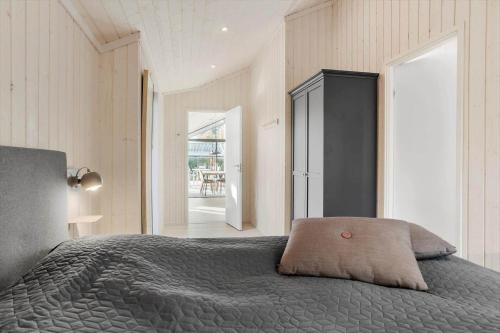 a bedroom with a bed with a gray comforter at 30319-Odder-Grindevej-19 in Odder